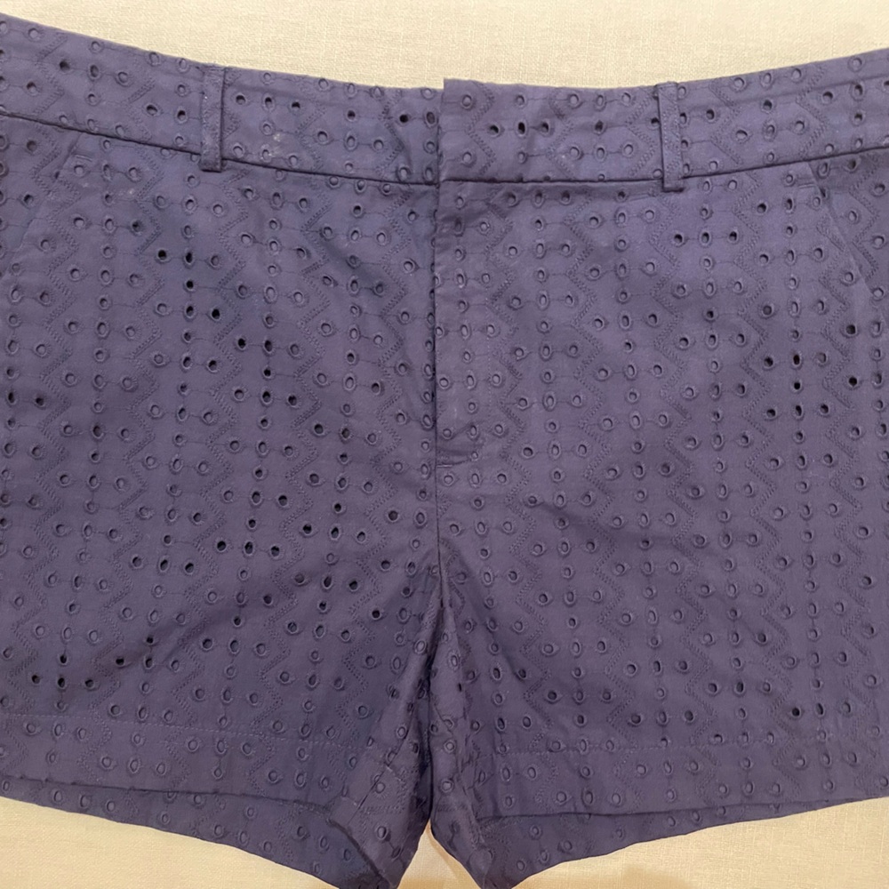 Navy blue eyelet shorts.